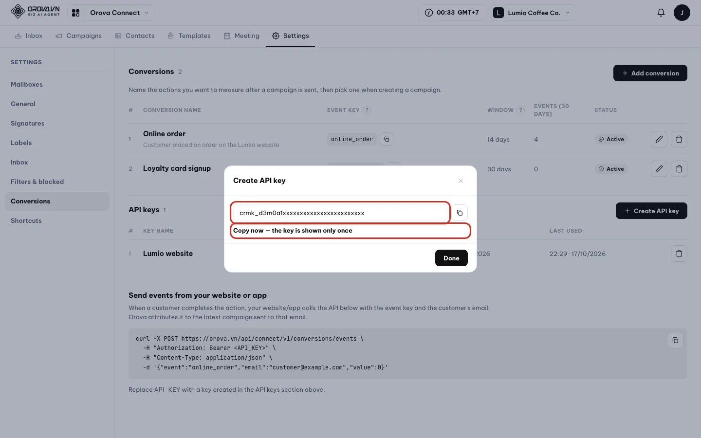 Create API key dialog, step two: the crmk_ key box and the line Copy now — the key is shown only once
